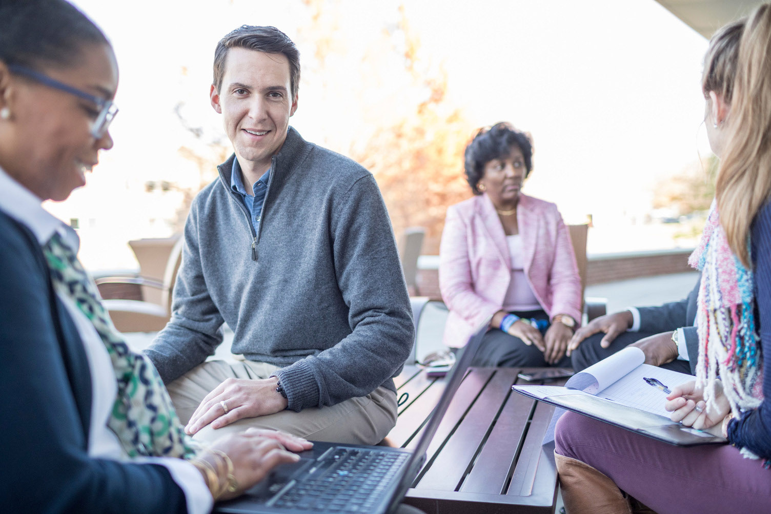ORAU employees participate in a group meeting