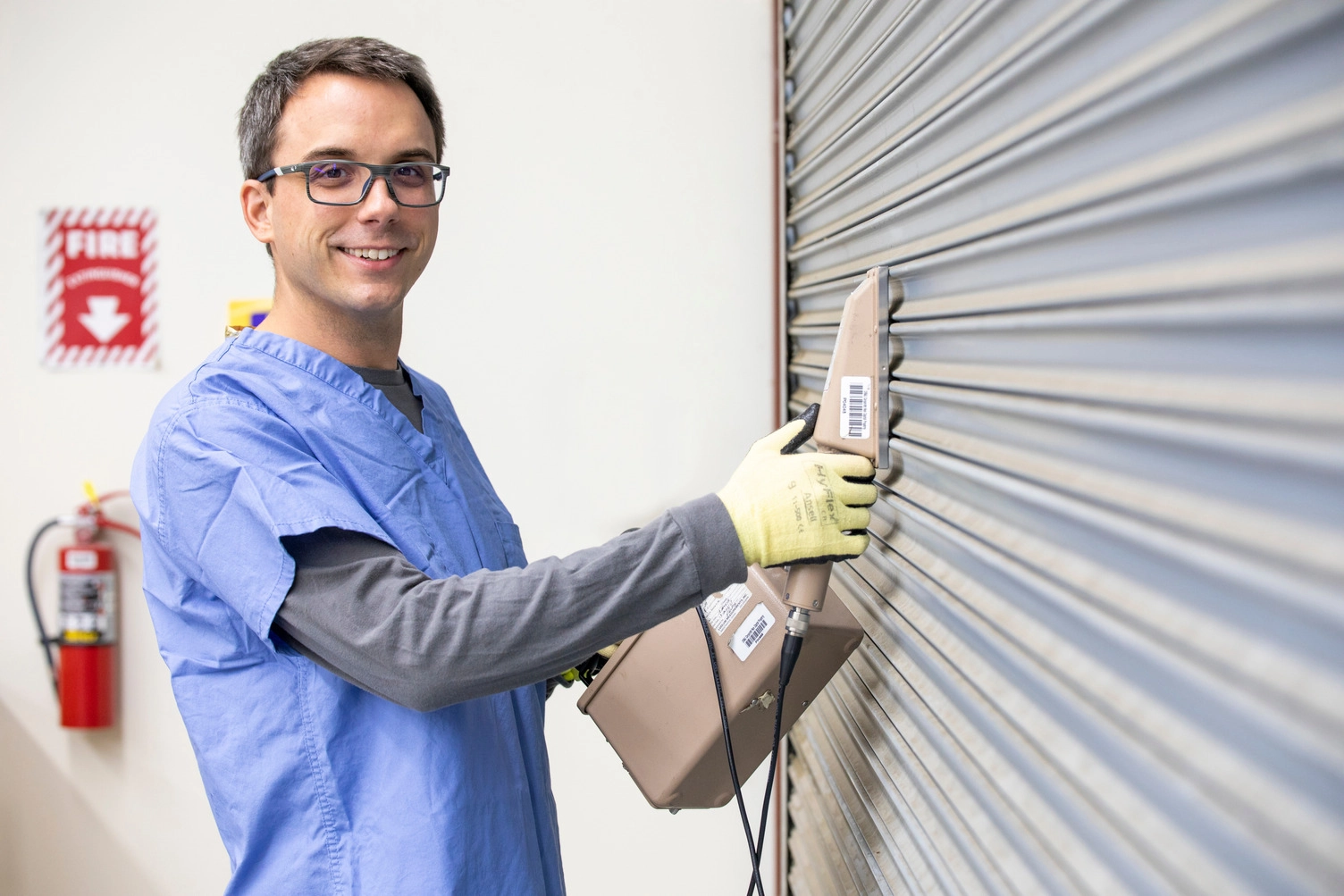 A male health physicist collects data during an indoor radiation survey