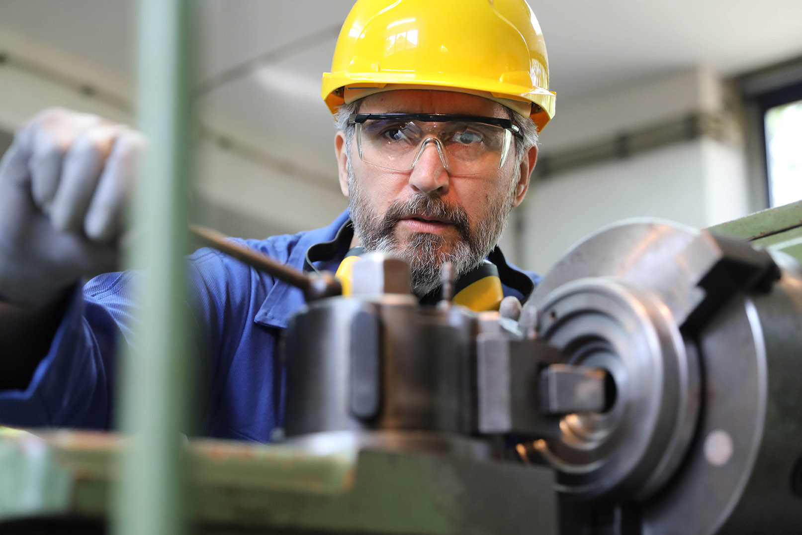 Industrial factory worker working in metal manufacturing
