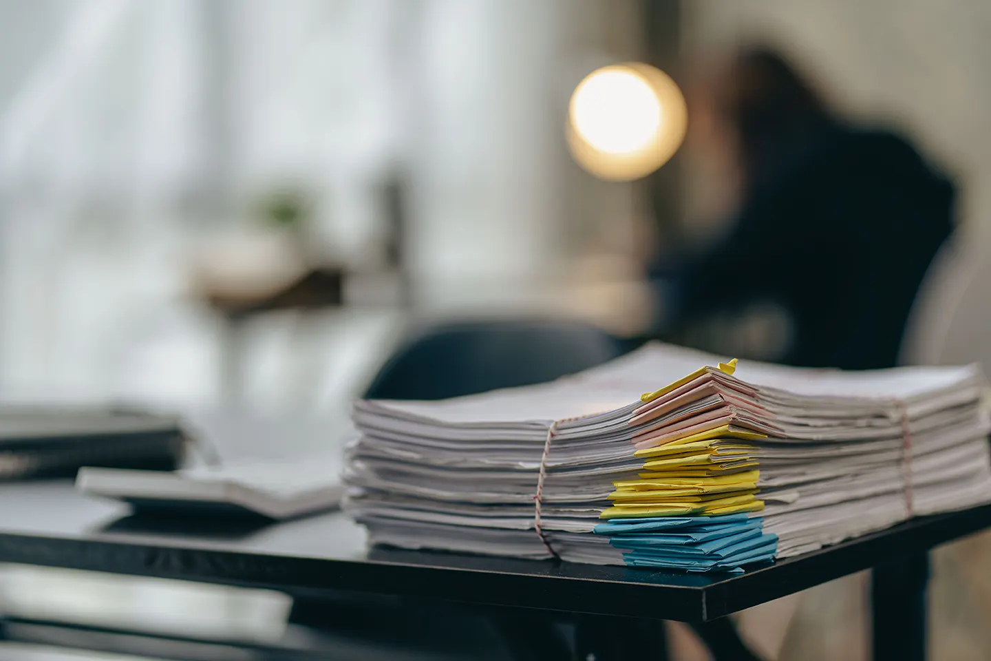 Archived documents with paper clips on the table