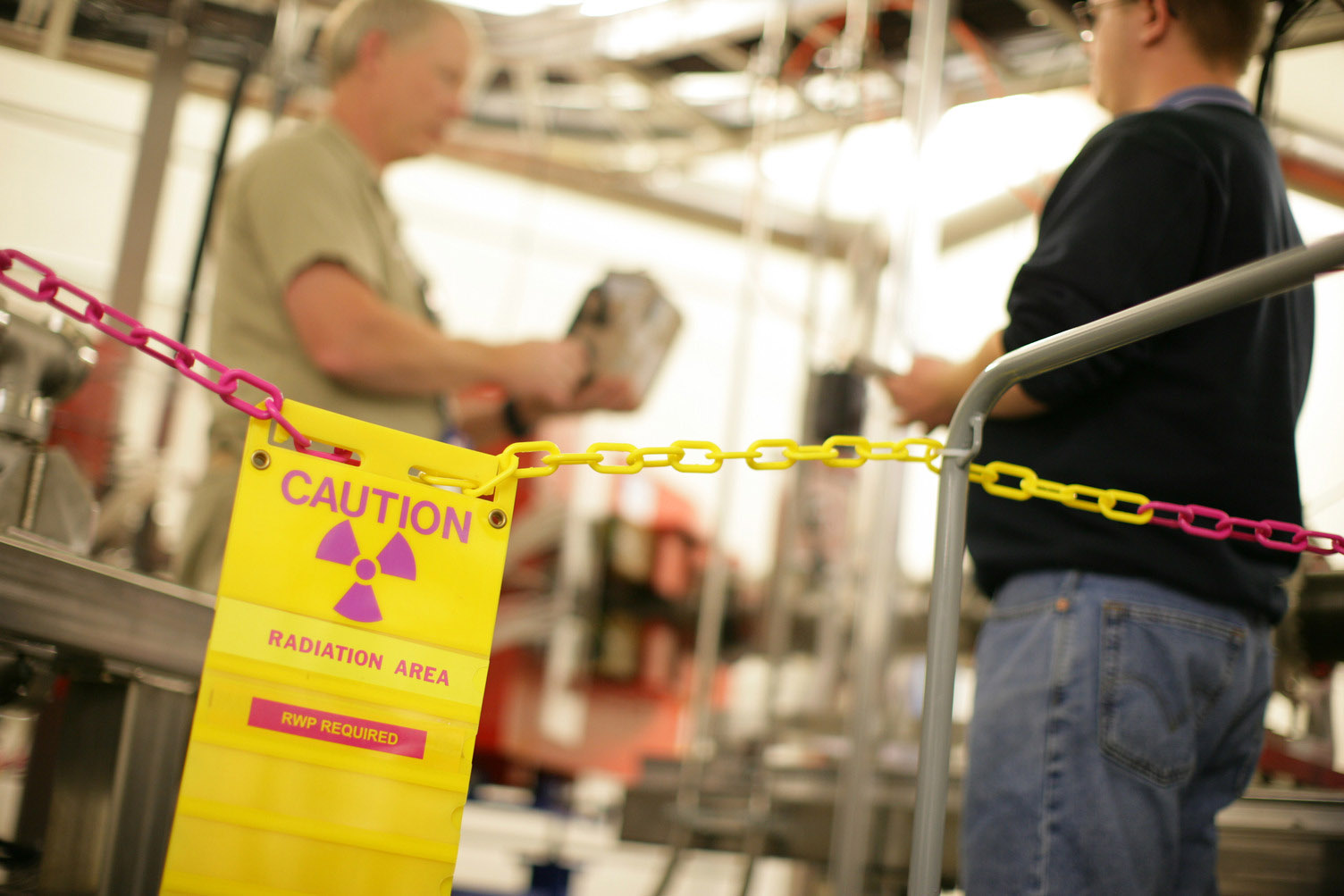 Safety staff testing a work environment for radiation