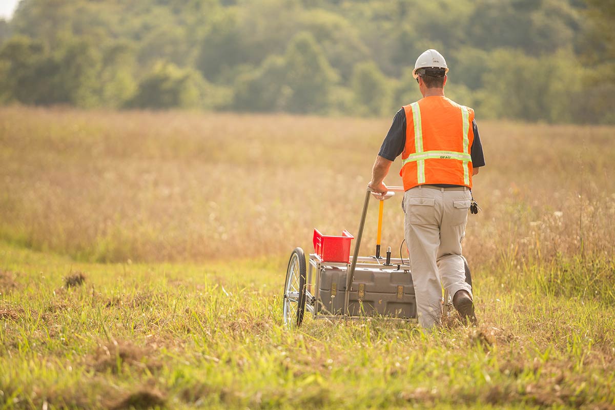 Worker conducting site characterization survey