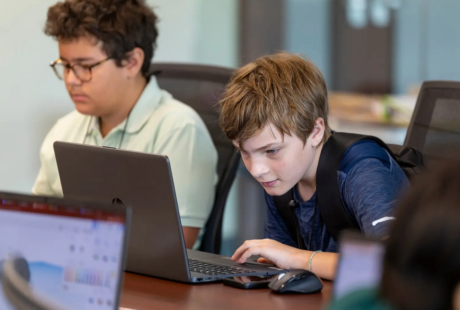Two male students work on research projects during the Appalachian STEM Academy