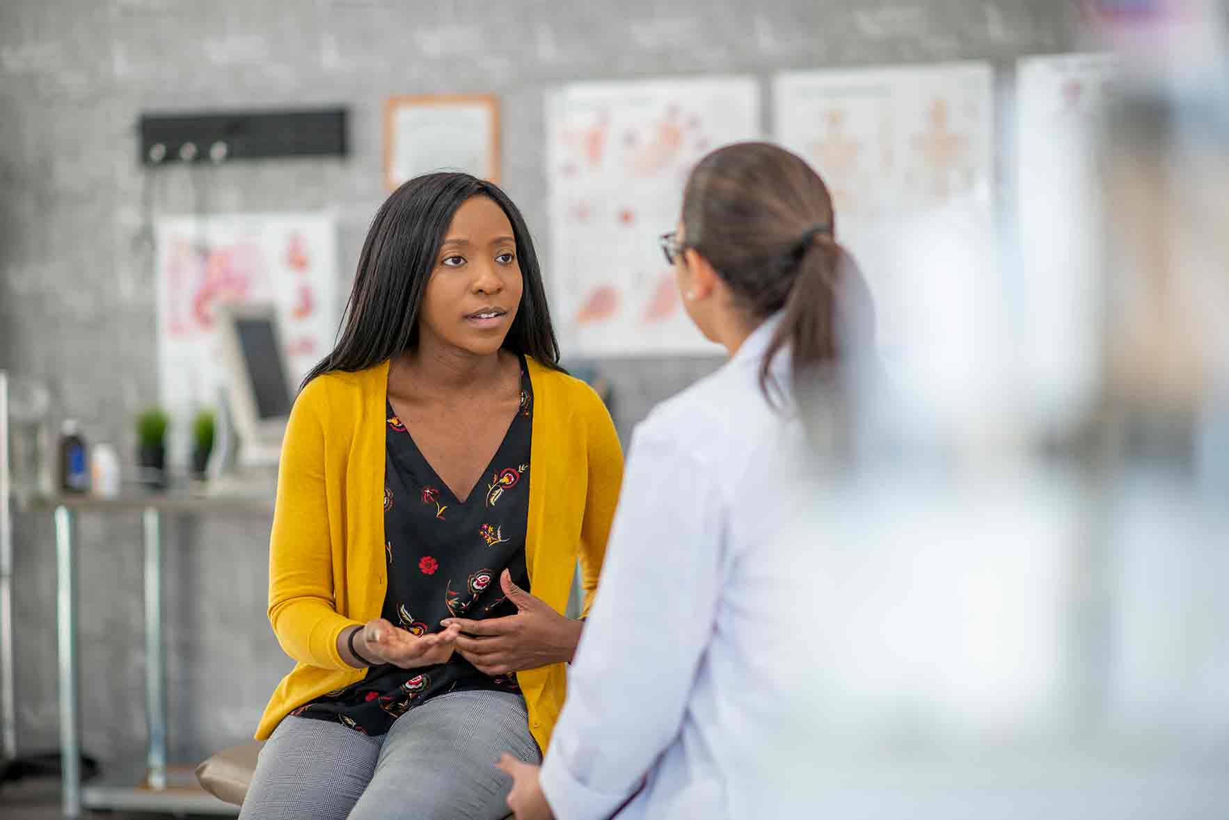 A female patient talks with a female doctor