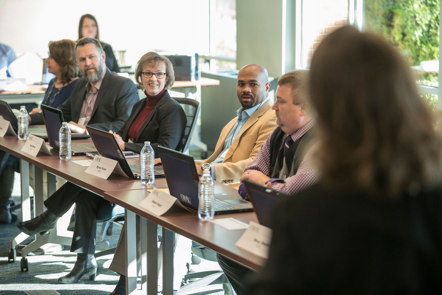 Subject matter experts participate in a peer review discussion