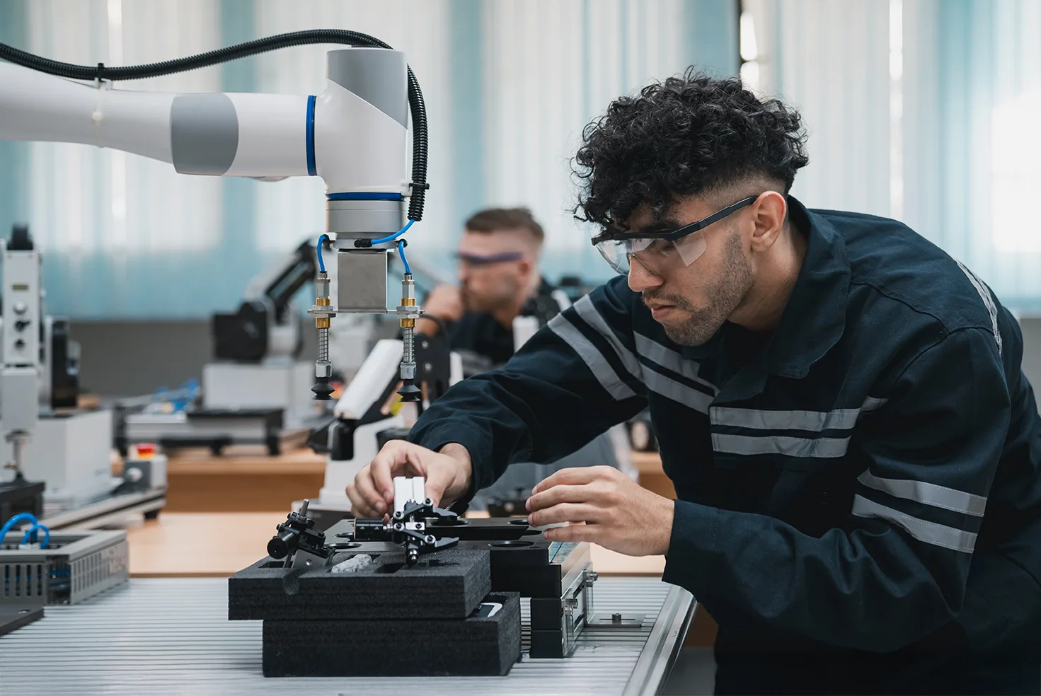 A research engineer works in a high tech laboratory