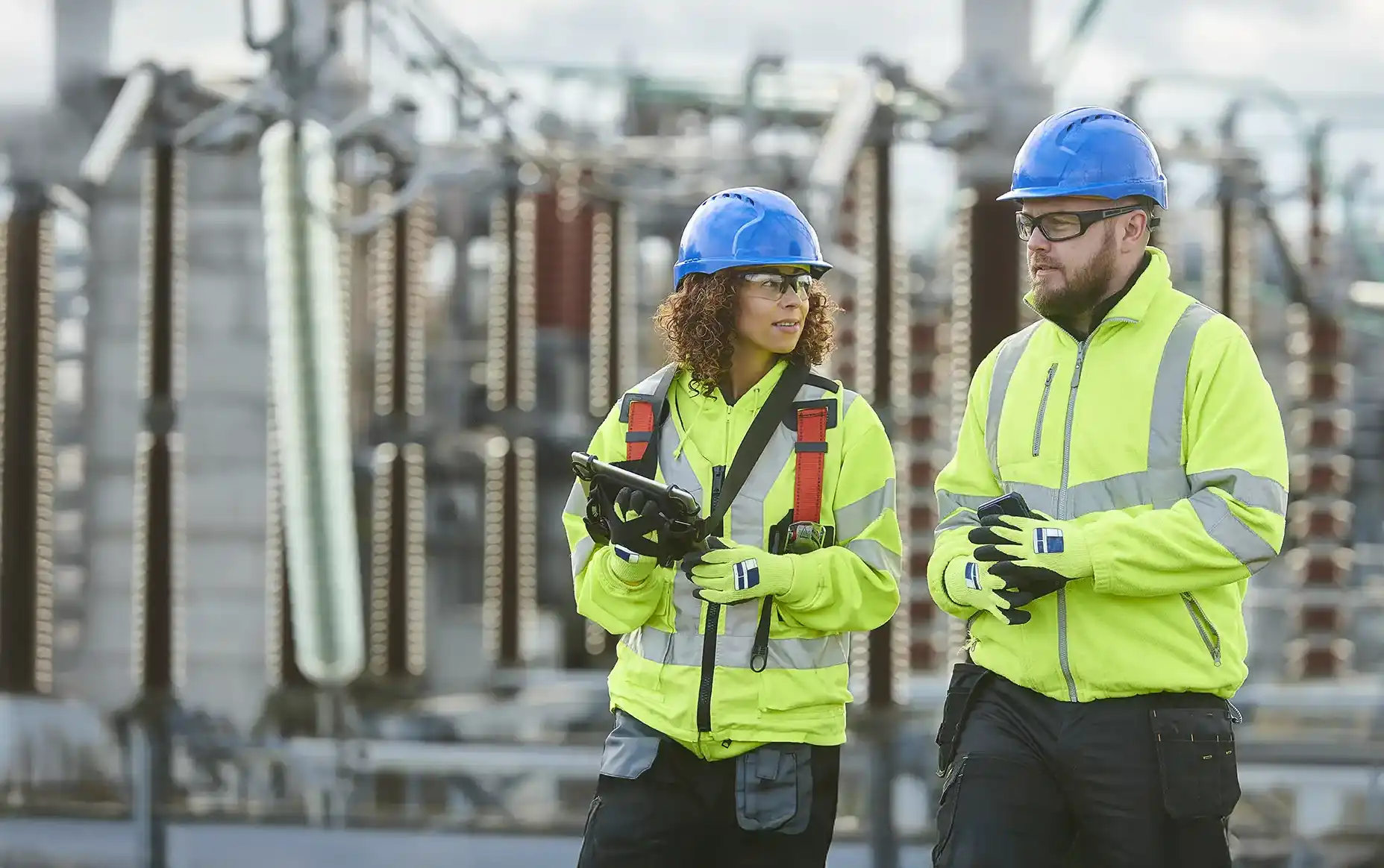 Two workers outside at a nuclear plant