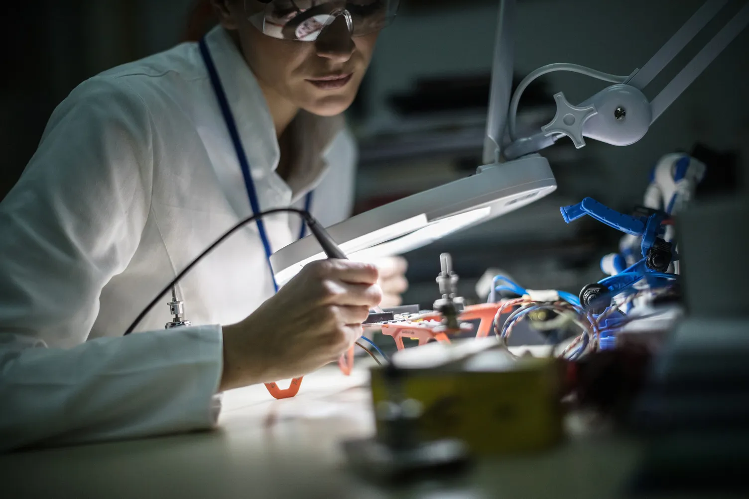 A woman conducts research in a laboratory setting