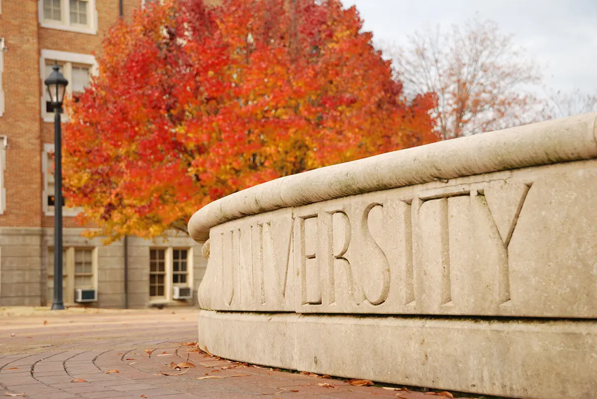 Stone marquee sign at a university